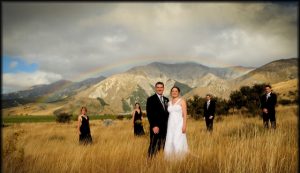 Rainbow wedding on a hill